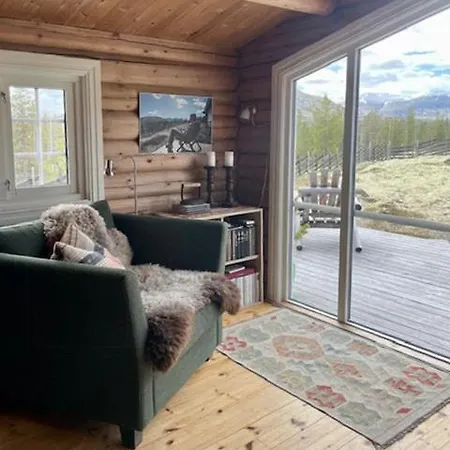 Log With Views Of Rondane Mountains